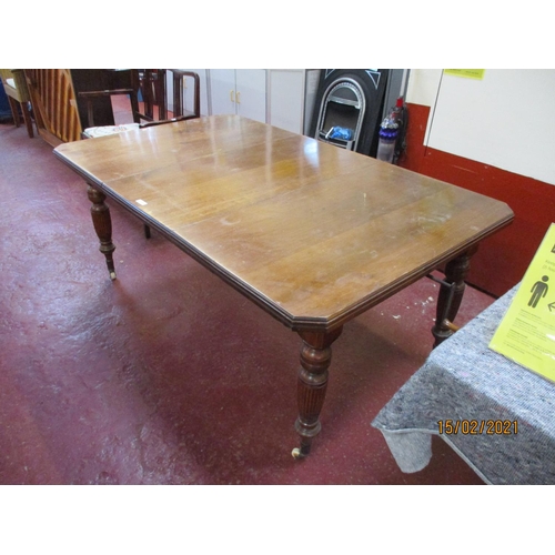 219 - An Edwardian walnut extending dining table