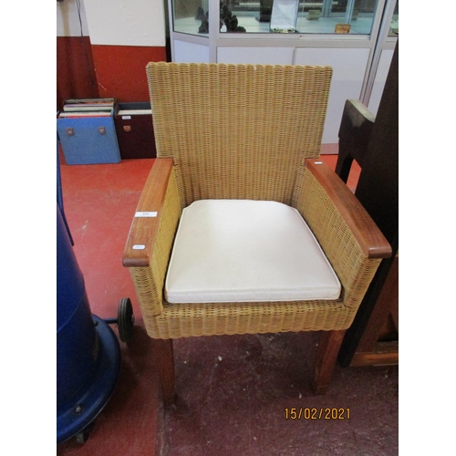 222 - A rattan armchair