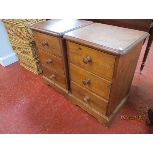 232 - A pair of pine three drawer bedside chests