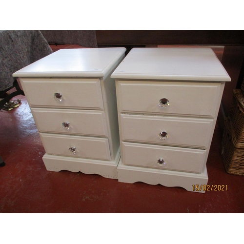 234 - A pair of white finished three drawer bedside chests