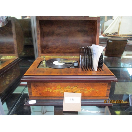 186 - A Reuge Music of Switzerland polyphon musical box containing nine different discs