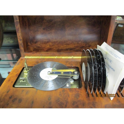 186 - A Reuge Music of Switzerland polyphon musical box containing nine different discs