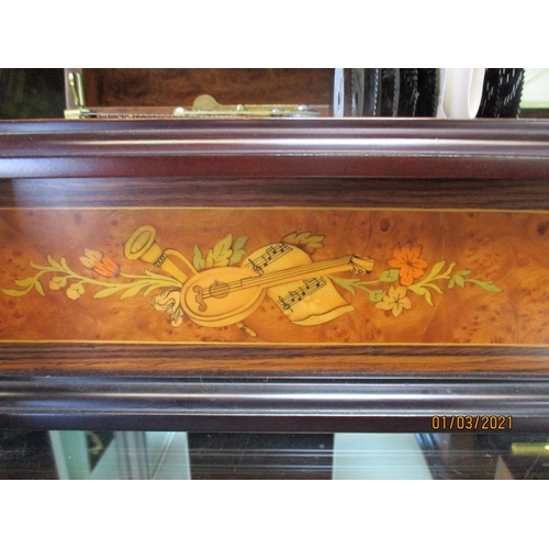 186 - A Reuge Music of Switzerland polyphon musical box containing nine different discs