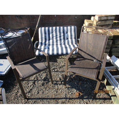 43 - A pair of metallic framed patio chairs together with a similar two seater chair