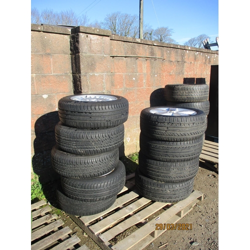 59 - Assorted aluminium car wheels and tyres