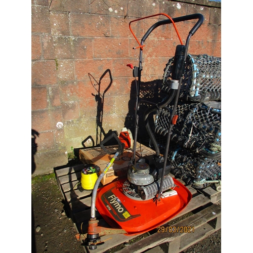 63 - A Flymo Contractor GT2 petrol hover mower, a Stihl FS35 strimmer and a roll of strimmer nylon