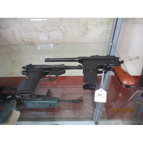 382 - A CO2 powered semi automatic pistol together with a replica P38 pistol