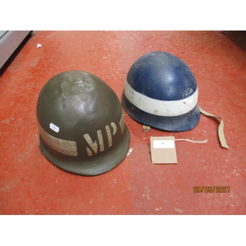 387 - A World War II United States military police helmet