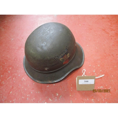 387 - A World War II United States military police helmet