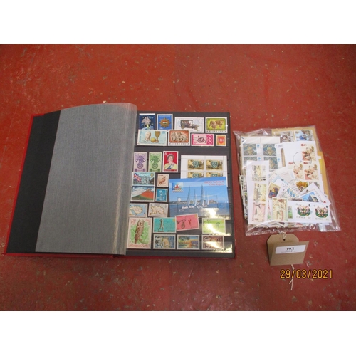 393 - An album of postage stamps together with an assortment of loose postage stamps