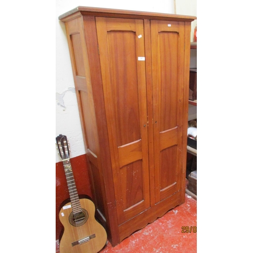 428 - A hard wood cupboard