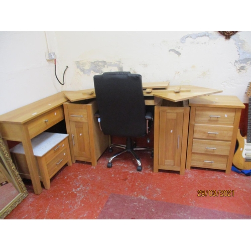 430 - A contemporary solid oak corner work station together with a revolving directors chair upholstered i... 