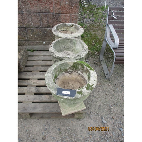 31 - Three vintage reconstituted stone stemmed garden urns