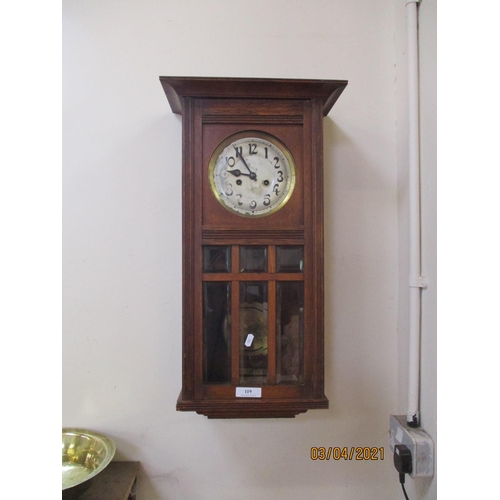 119 - An early twentieth century oak cased wall clock