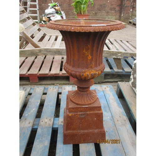 77 - A cast metallic stemmed garden urn on plinth