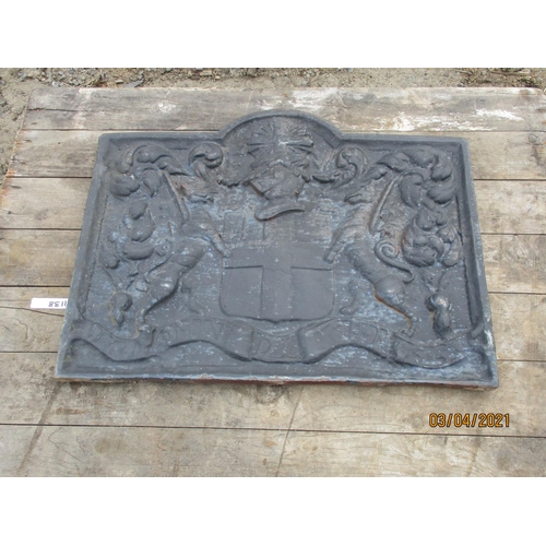 89 - A cast iron fire back with heraldic decoration of large proportion