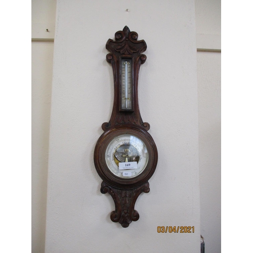 169 - A vintage oak cased aneroid barometer