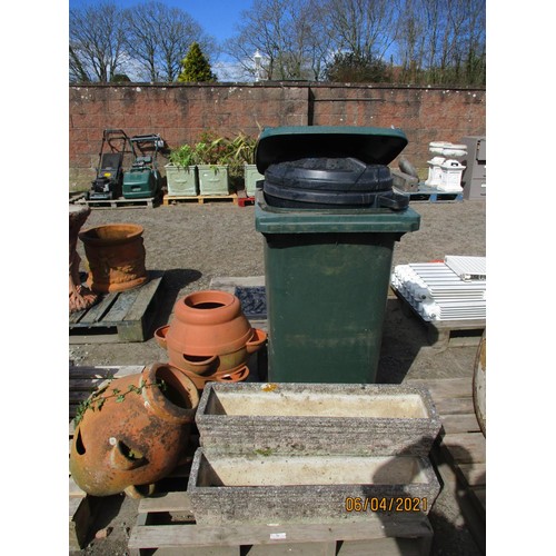 72 - Two strawberry pots, three reconstituted stone flower troughs, a wheelie bin etc.