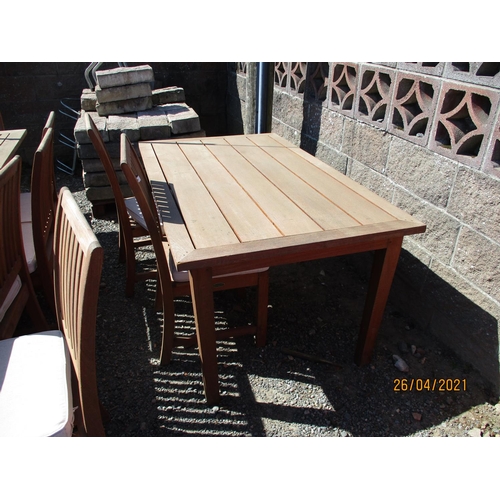 49 - A Westminster teak twelve cover extending garden table together with twelve matching chairs and serv... 