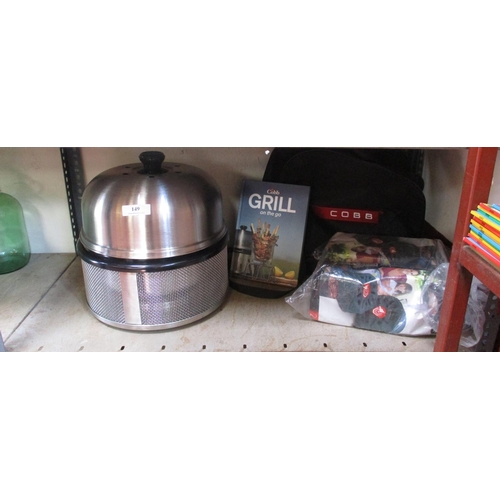 149 - A Cobb grill and accessories