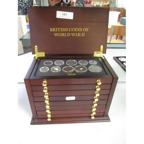 183 - A mahogany coin cabinet of eight drawers containing a collection of British coins of World War II