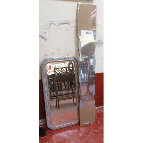 397 - A bevelled wall mirror the frame with gilt and floral decoration together with four contoured wall m... 