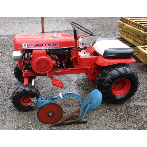 28 - A 1960s wheel horse lawn ranger garden tractor together with two mower decks and a single furrow plo... 