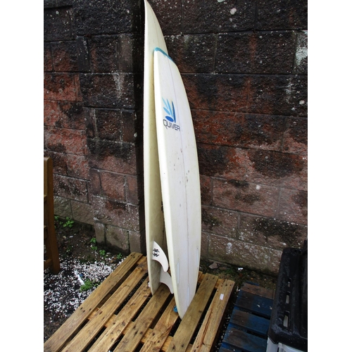 43 - A Quiver surfboard together with a Spider surfboard