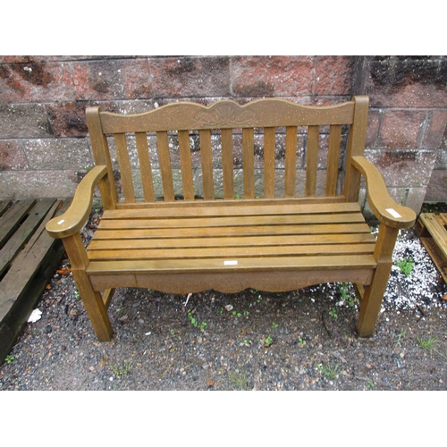 44 - A solid teak garden bench