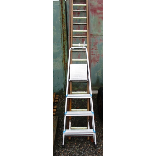 48 - A wooden and aluminium sixteen tread extension ladder together with an aluminium step ladder