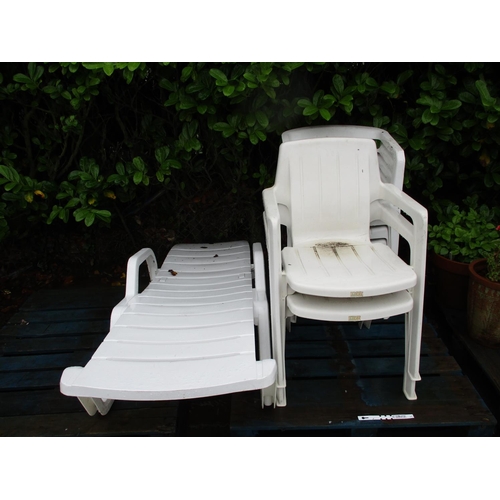 52 - Six plastic patio chairs together with a similar sun lounger