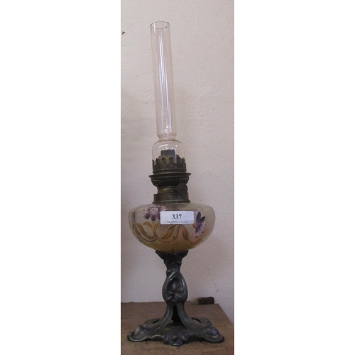 337 - An Arts & Crafts paraffin oil lamp the glass tank with hand painted floral decoration