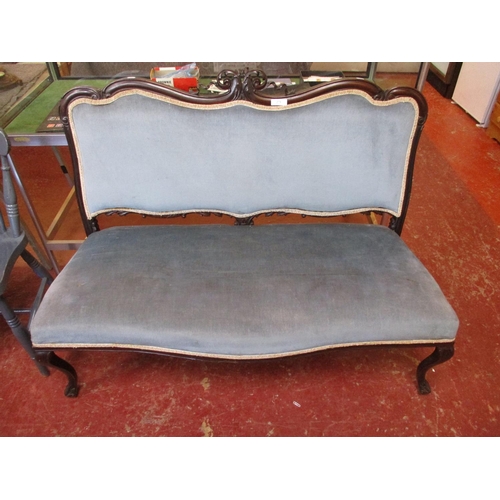 271 - A vintage mahogany framed salon settee upholstered in blue coloured fabric