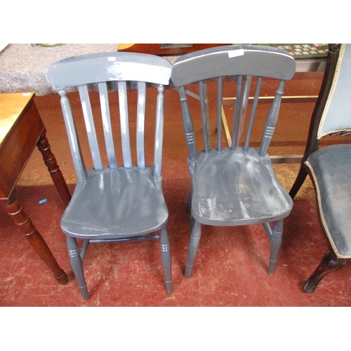 272 - A pair of vintage over painted elm seated kitchen chairs