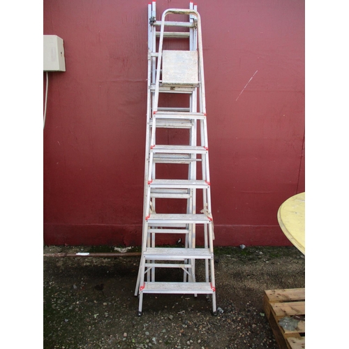 54 - A seven tread stepladder together with an adjustable stepladder and a seven tread extension ladder