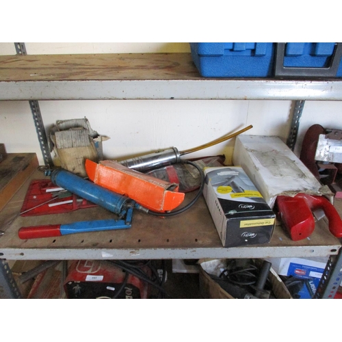 101 - A Taskmaster bench grinder, a Black & Decker bench grinder, a laser level, grease guns and other gar... 