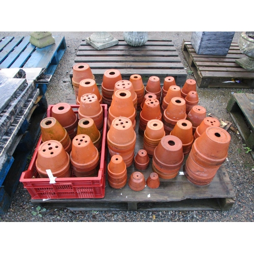 72 - A large and varied accumulation of terracotta flower pots