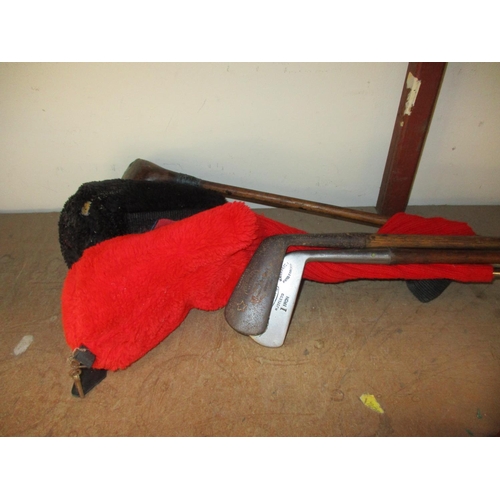 106 - A quantity of vintage golf clubs