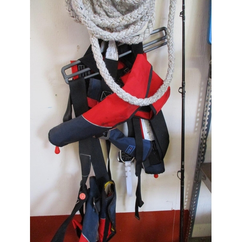 68 - A warp rope, two Seago life vests, an Assassin 6'6