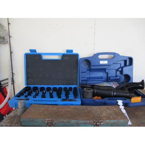 69 - A set of impact sockets, a labour saving wrench and a set of metal letters and numbers