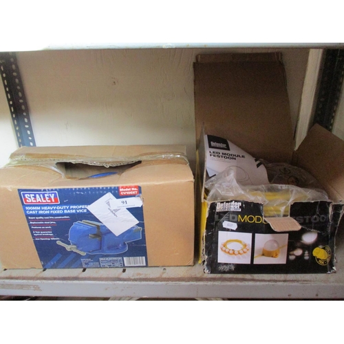 91 - A Sealey base vice together with a set of festoon lights