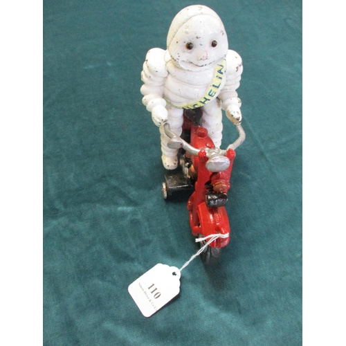 110 - A cast iron Michelin man on motorbike