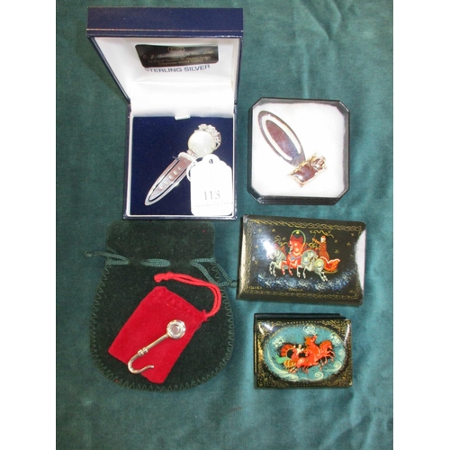 113 - Two sterling silver bookmarks, a sterling silver napkin clip and two Russian papier mache trinket bo... 