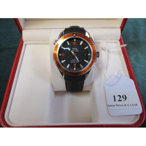 129 - An Omega Seamaster Planet Ocean wrist watch with spare strap, box and paper work