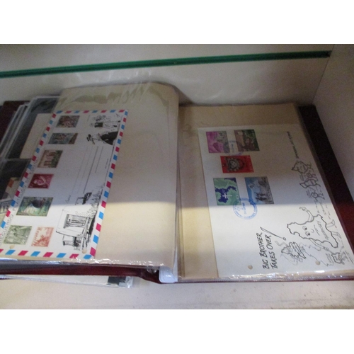 162 - A quantity of first day covers and stamps