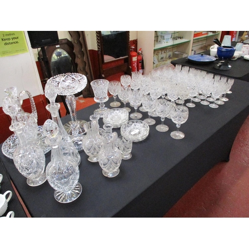 238 - A large and varied accumulation of crystal drinking glasses, decanters, dishes, candle stick holders... 