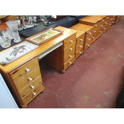 290 - A suite of honey glazed pine bedroom furniture to consist of a wardrobe fitted a drawer below, two c... 