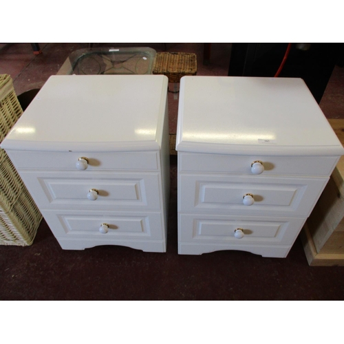 305 - A pair of white finished three drawer bedside chests