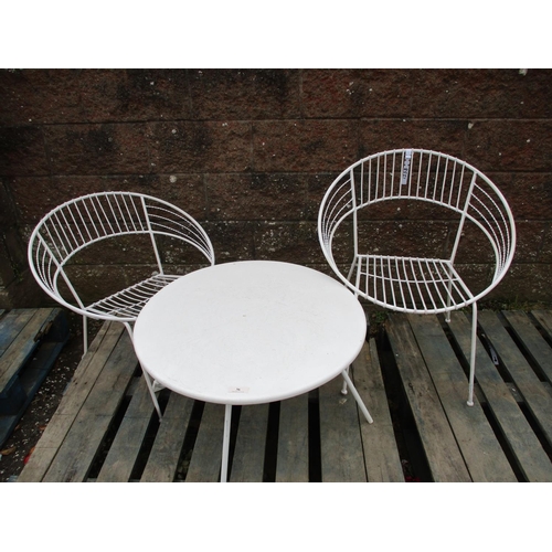 36 - A metallic circular patio table together with a pair of wirework chairs