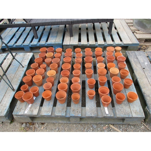 63 - A large quantity of terracotta flower pots of diminutive form